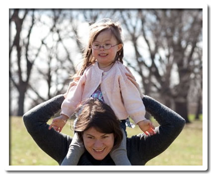 Stephanie Meredith with a child on her shoulders.