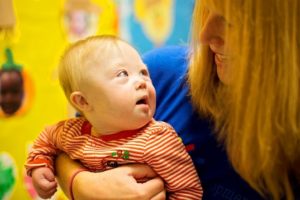 Adult holding an infant