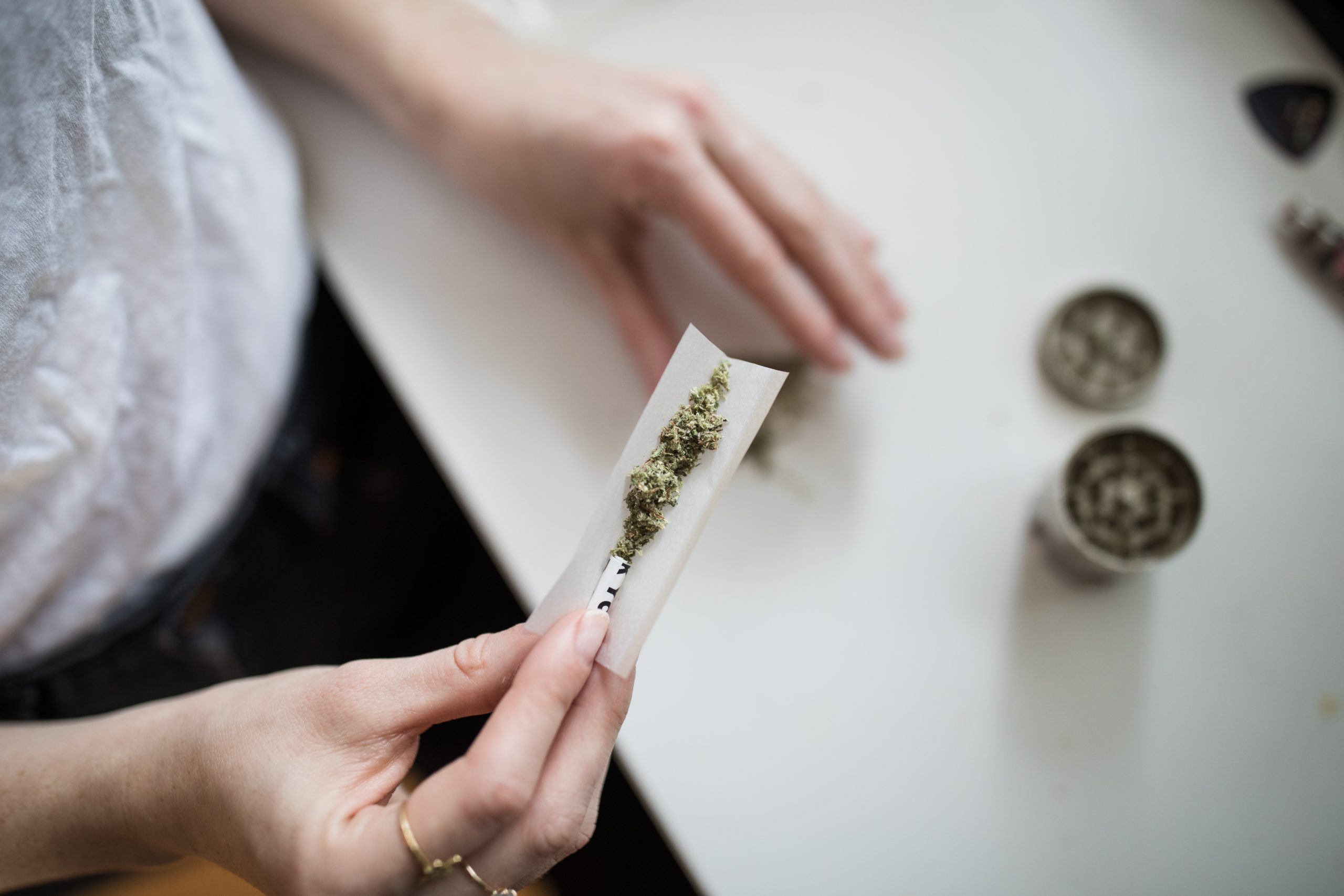 A photo of a person making cannabis