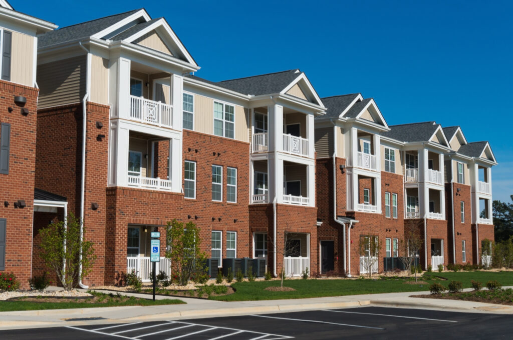 outside view of an apartment complex on a sunny day