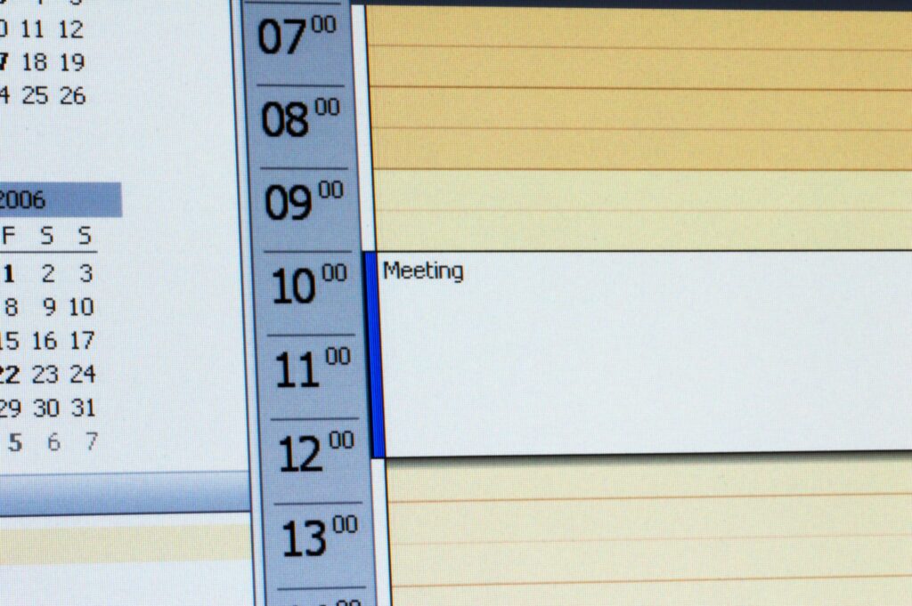 Microsoft calendar with scheduled meeting.