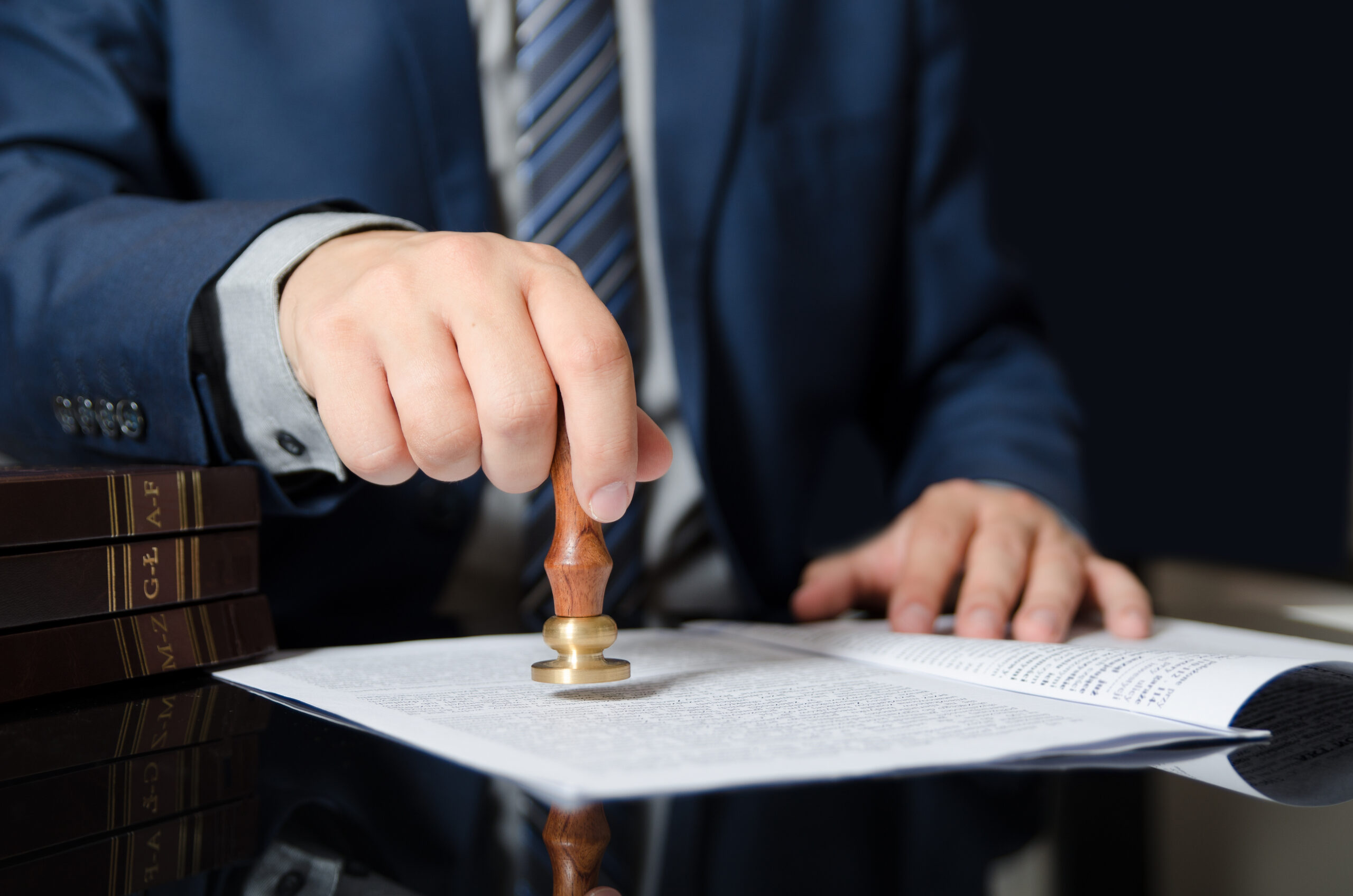 Person stamping a document