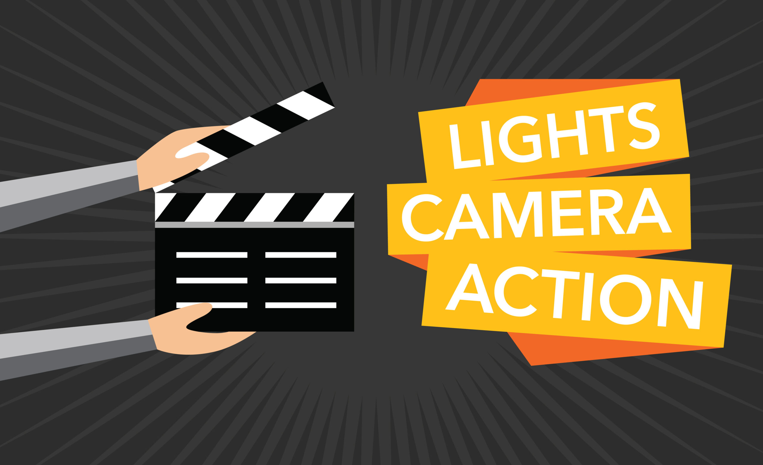 Hands holding clapboard, with the words, "Lights, Camera, Action"