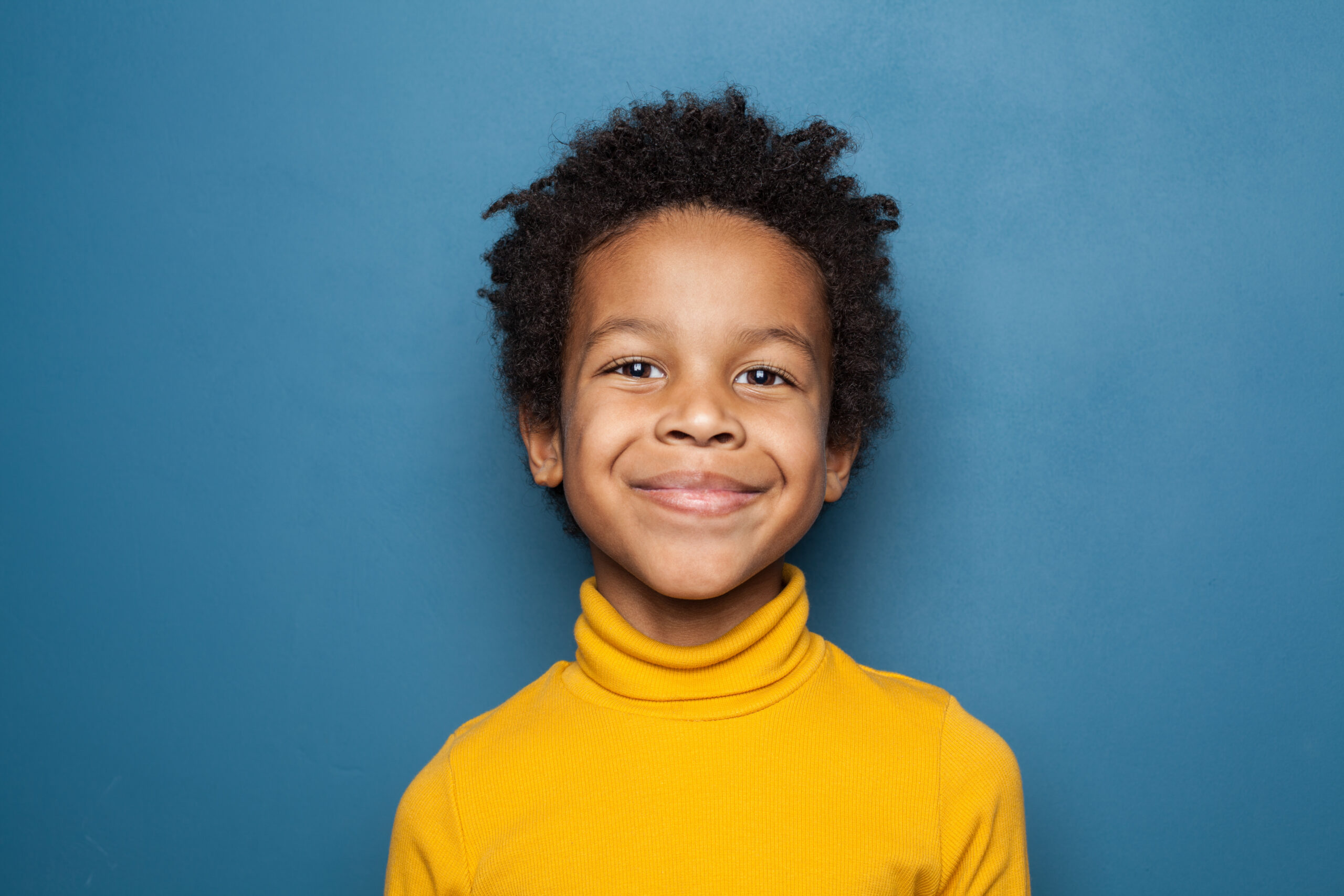 Child with a smile on their face.
