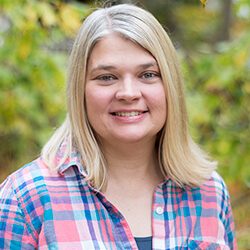 Headshot of Tammy Greene outside in front of trees.